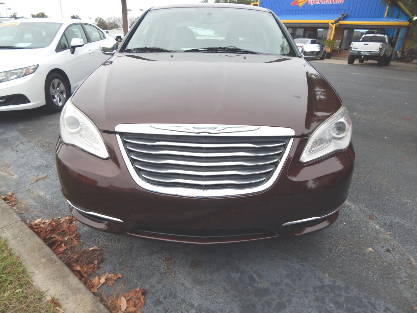 2013 Burgundy /Tan Leather Chrysler 200 Limited (1C3CCBCG3DN) with an 3.6L 6 Cyl. engine, Automatic transmission, located at 3120 W Tennessee St, Tallahassee, FL, 32304-1002, (850) 575-6702, 30.458841, -84.349648 - Used Car Supermarket is proud to present you with this loaded immaculate 2013 Chrysler 200 Limited with leather, sunroof and low miles. Used Car Supermarket prides itself in offering you the finest pre-owned vehicle in Tallahassee. Used Car Supermarket has been locally family owned and operated for - Photo#2